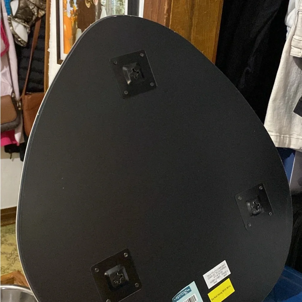Mirror that is odd shaped. It says 20x22 for sizing
